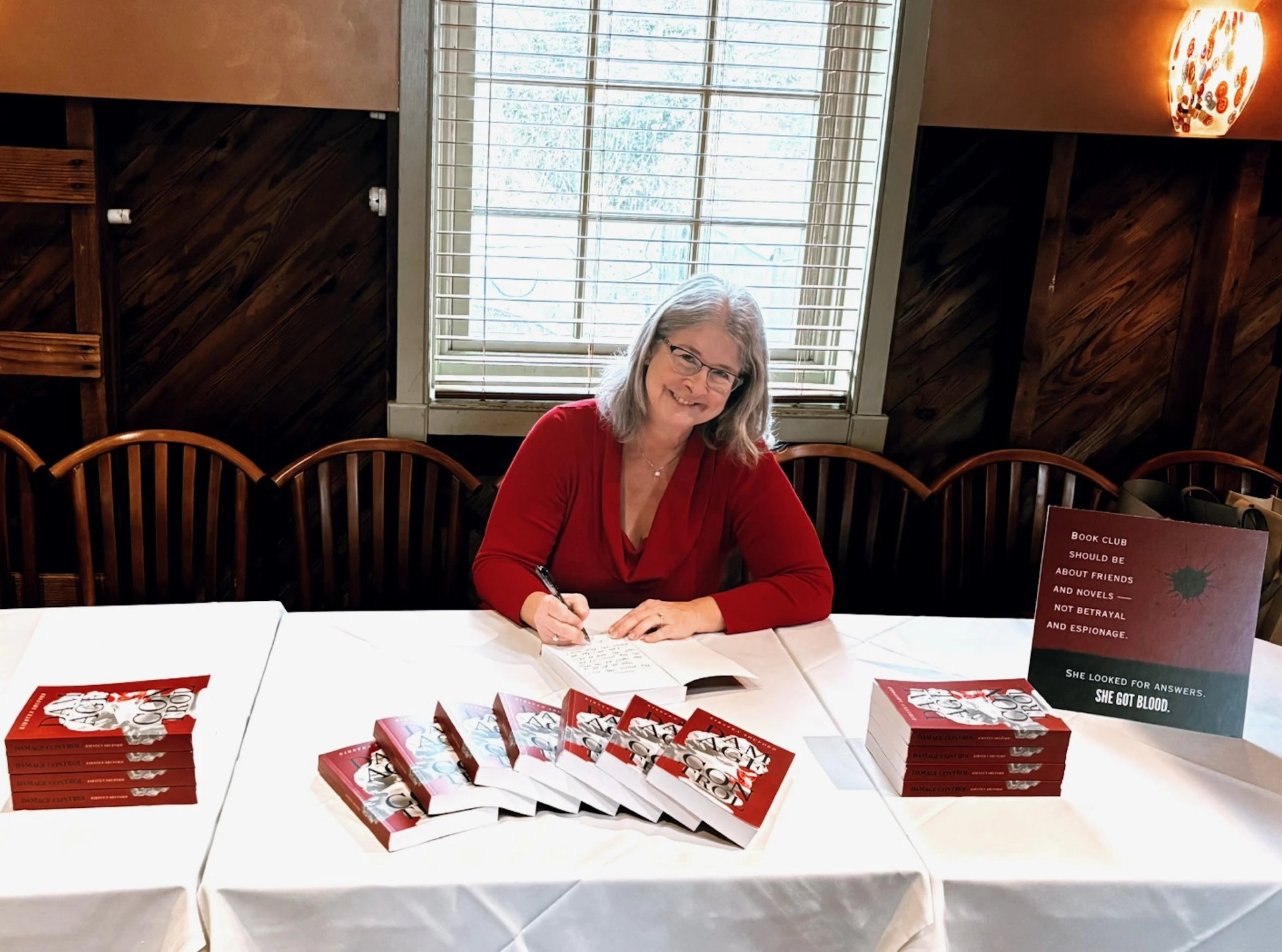 Kirsten Shuford signing books for readers